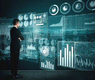 Big Data Technology for Business Finance Analytic Concept. Modern graphic interface shows massive information of business sale report, profit chart and stock market trends analysis on screen monitor.